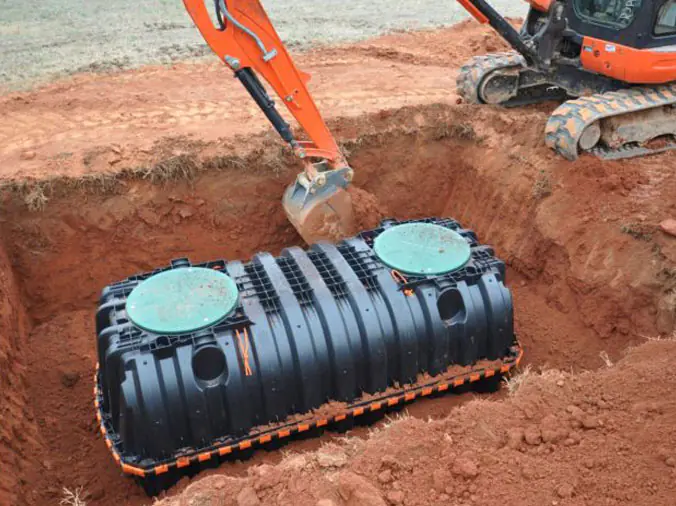 Septic tank being installed in the ground
